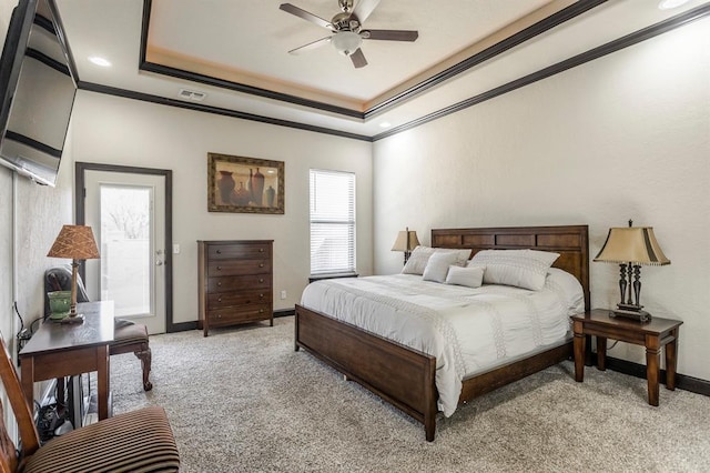 2241 W Mickey Dr, Mustang, OK 73064 - bedroom with light colored carpet, ornamental molding, a tray ceiling, and visible vents