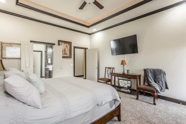 2241 W Mickey Dr, Mustang, OK 73064 - carpeted bedroom featuring a tray ceiling, a ceiling fan, baseboards, and ornamental molding