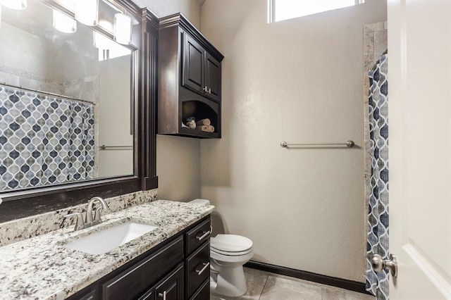 2241 W Mickey Dr, Mustang, OK 73064 - bathroom featuring tile patterned flooring, toilet, vanity, a shower with curtain, and baseboards