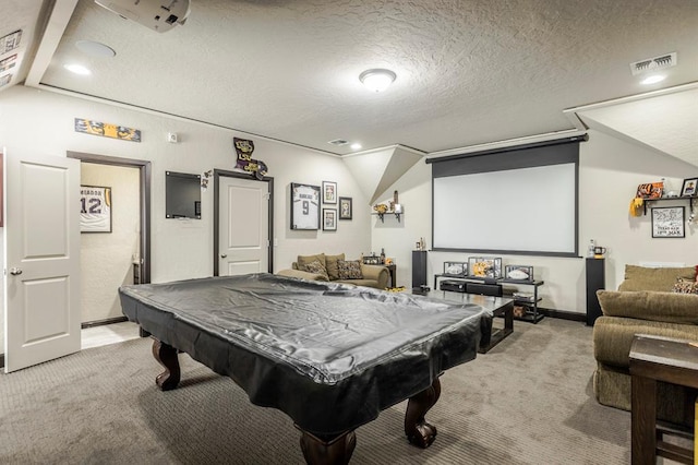 2241 W Mickey Dr, Mustang, OK 73064 - playroom with vaulted ceiling, visible vents, a textured ceiling, and light colored carpet