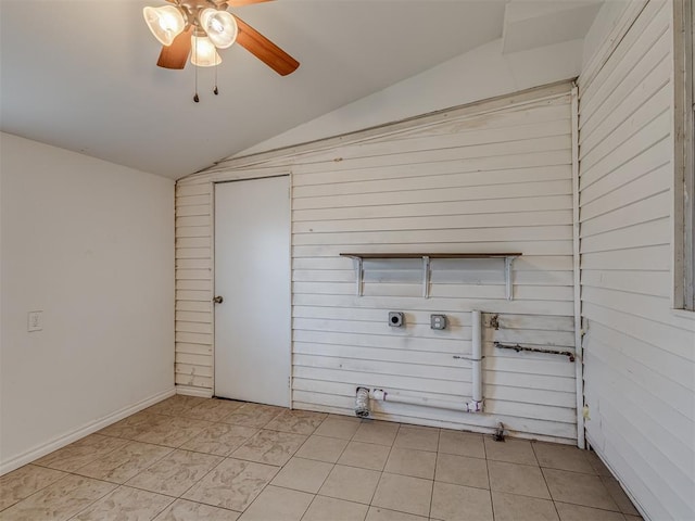 washroom with ceiling fan, light tile patterned flooring, and laundry area