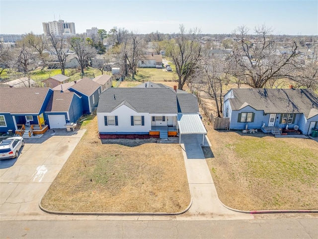 birds eye view of property with a residential view