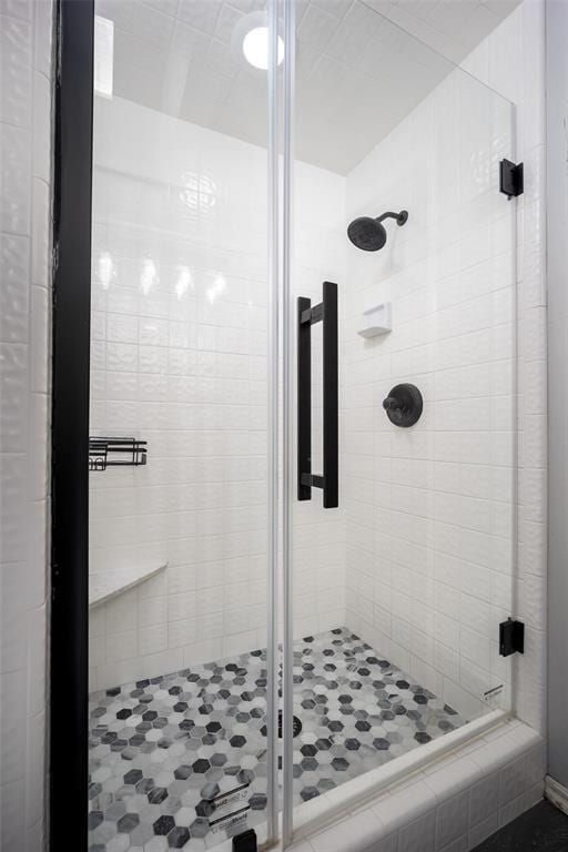 full bath featuring a shower stall