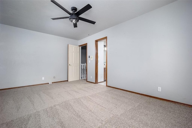 unfurnished bedroom featuring light carpet, a ceiling fan, and baseboards