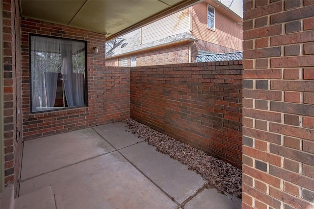 view of patio featuring fence