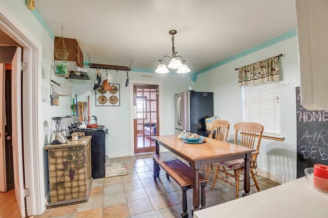 501 SE 15th St, Oklahoma City, OK 73129 - dining area with baseboards and light tile patterned floors