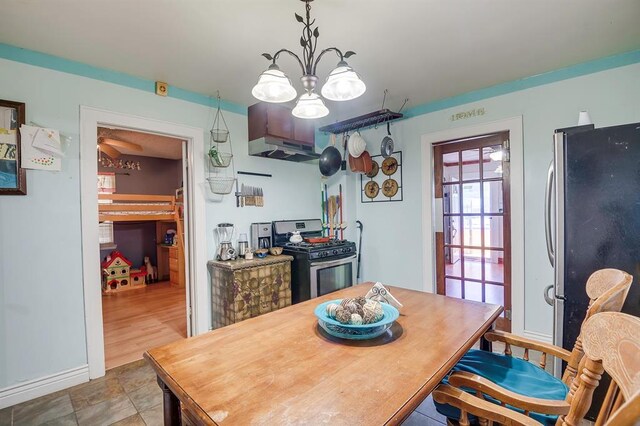 501 SE 15th St, Oklahoma City, OK 73129 - dining area featuring a notable chandelier