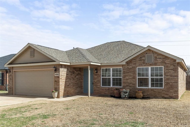 ranch-style house with brick siding, a shingled roof, concrete driveway, a front yard, and an attached garage