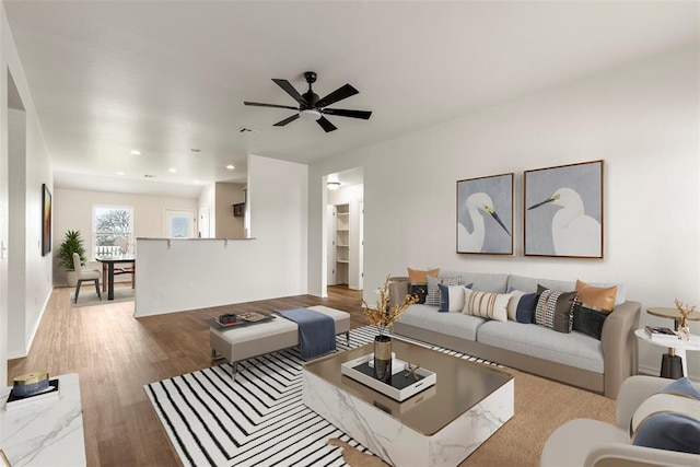 living area featuring a ceiling fan, recessed lighting, wood finished floors, and visible vents