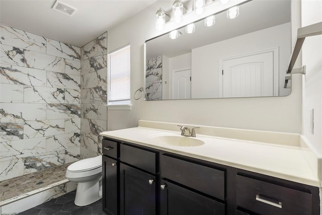 full bathroom featuring visible vents, toilet, marble finish floor, a shower stall, and vanity