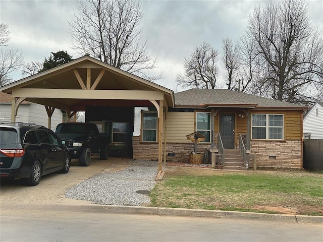 view of front of home featuring crawl space and concrete driveway