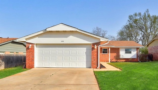 ranch-style house with a front yard, fence, brick siding, and driveway