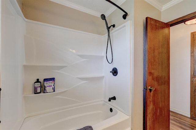 full bathroom with shower / washtub combination, wood finished floors, and ornamental molding