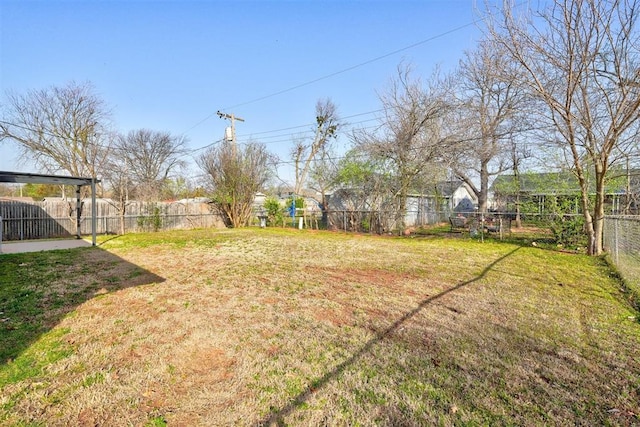 view of yard with a fenced backyard