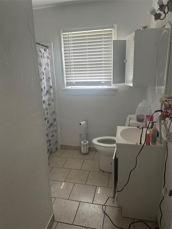 118 NE 2nd St, Moore, OK 73160 - full bathroom featuring vanity, toilet, tile patterned floors, and a shower with shower curtain
