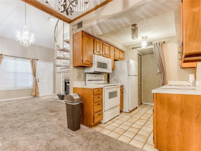 kitchen featuring white appliances, an inviting chandelier, a sink, light countertops, and light colored carpet