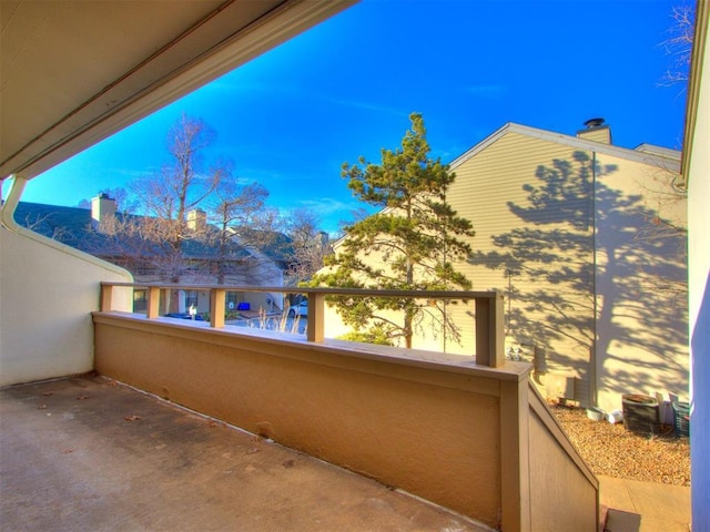 view of patio featuring a balcony