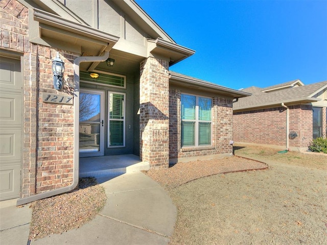 entrance to property with brick siding