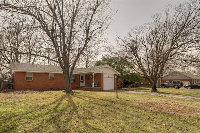 ranch-style home featuring brick siding, driveway, a front lawn, and an attached garage