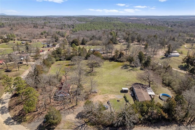 drone / aerial view featuring a view of trees