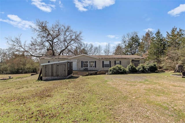 back of property featuring a yard