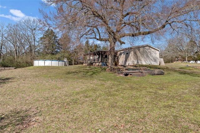 view of yard with an outdoor pool