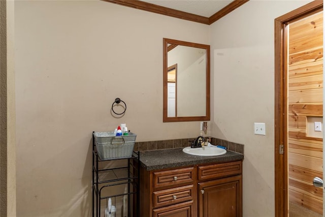 bathroom with vanity and crown molding