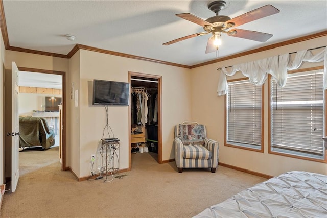 bedroom with baseboards, light carpet, ornamental molding, and a spacious closet