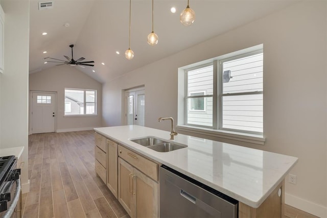 kitchen featuring visible vents, a sink, light wood-style floors, stove, and dishwasher