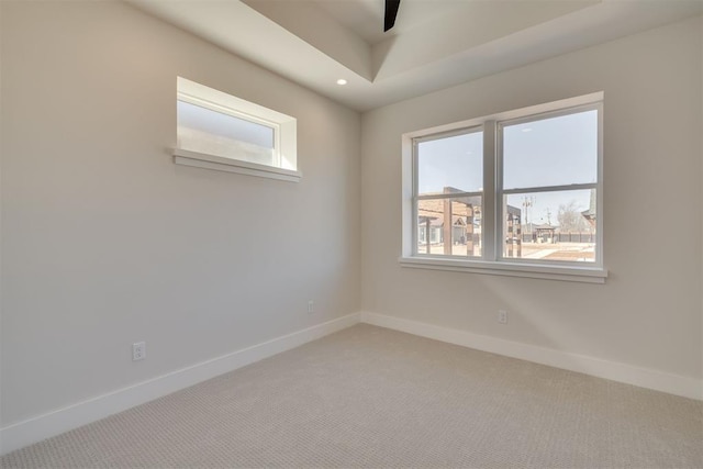 empty room featuring recessed lighting, baseboards, carpet, and a healthy amount of sunlight