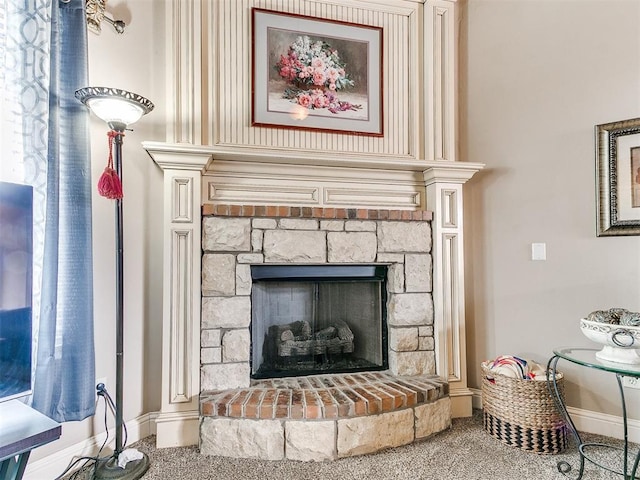 room details with a fireplace, baseboards, and carpet floors