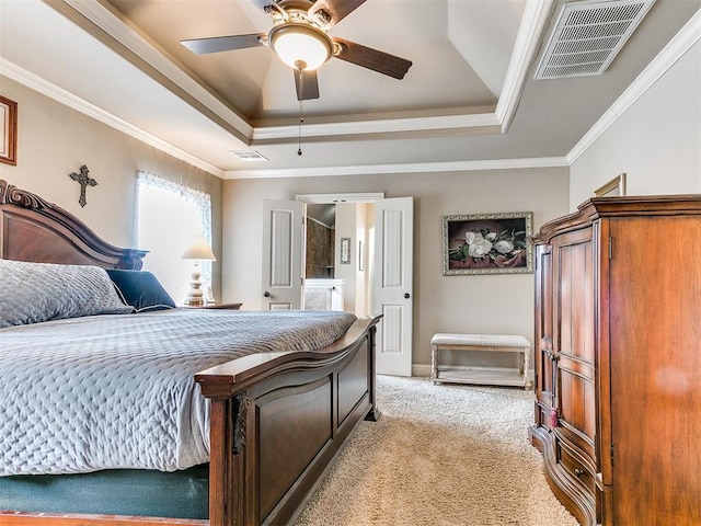 bedroom featuring a raised ceiling, crown molding, visible vents, and light carpet