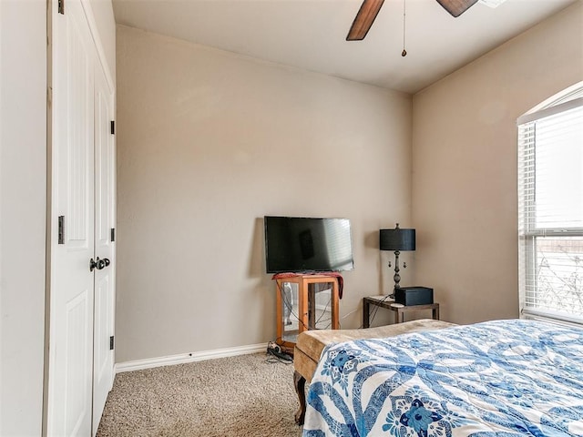 bedroom featuring a ceiling fan, baseboards, and carpet floors