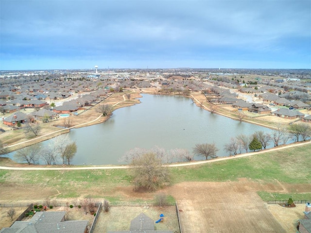 bird's eye view with a residential view and a water view