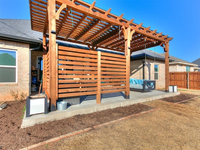 view of patio / terrace with fence and a pergola