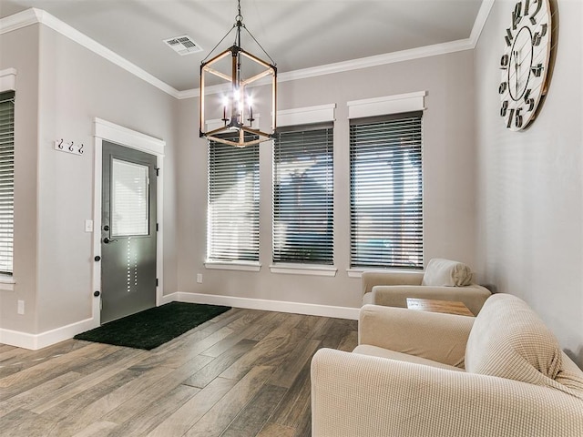 foyer with visible vents, crown molding, baseboards, a chandelier, and dark wood-style flooring