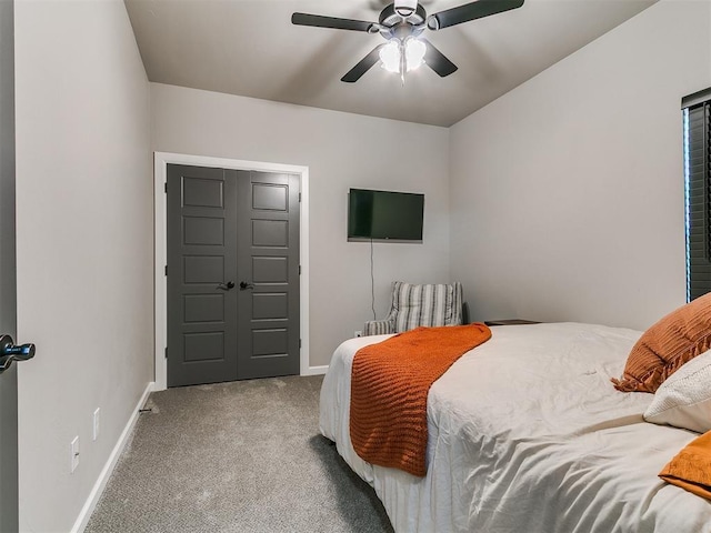 bedroom with baseboards, carpet floors, and a ceiling fan