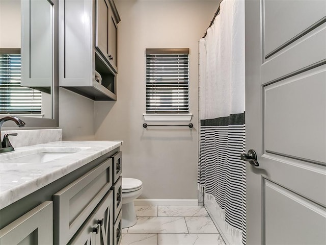 full bath with vanity, a shower with curtain, baseboards, toilet, and marble finish floor