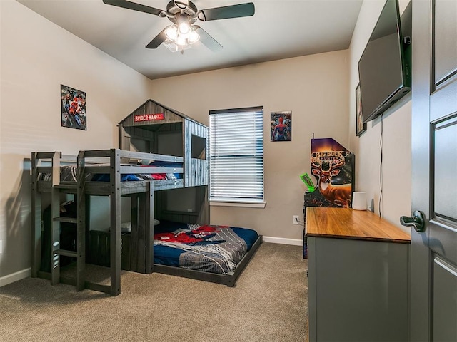 bedroom featuring baseboards, carpet, and ceiling fan