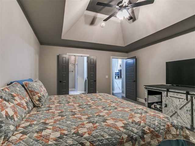 bedroom featuring baseboards, a raised ceiling, ceiling fan, and vaulted ceiling