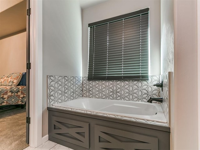 ensuite bathroom with ensuite bath and a garden tub