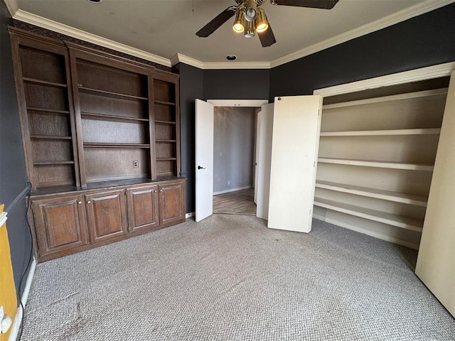 unfurnished bedroom with carpet flooring, ceiling fan, and ornamental molding