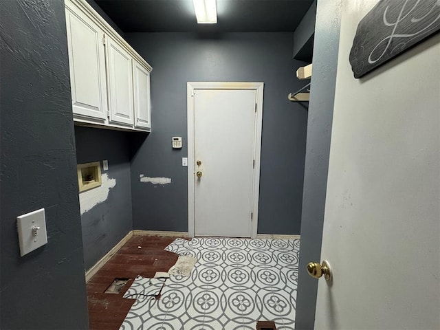 laundry room with hookup for a washing machine and baseboards