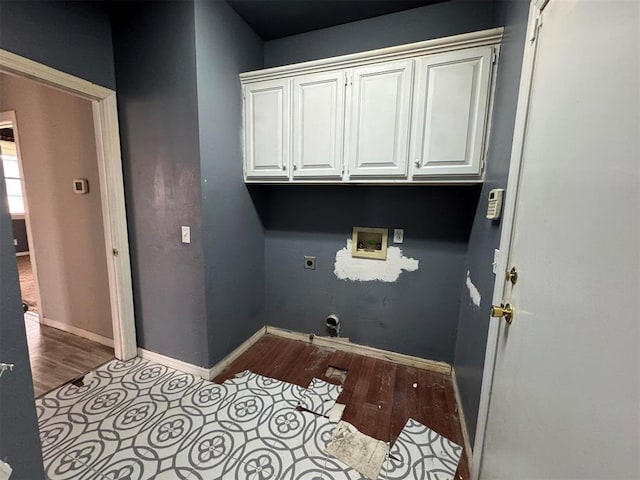 washroom with electric dryer hookup, wood finished floors, cabinet space, baseboards, and hookup for a washing machine