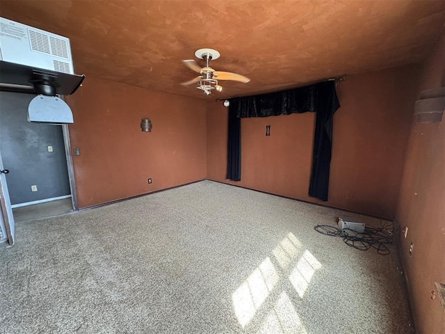 interior space with visible vents and ceiling fan