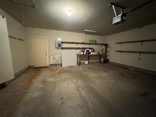 garage with electric panel and a garage door opener