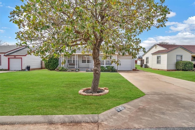 view of front of property with driveway, a front yard, and an attached garage