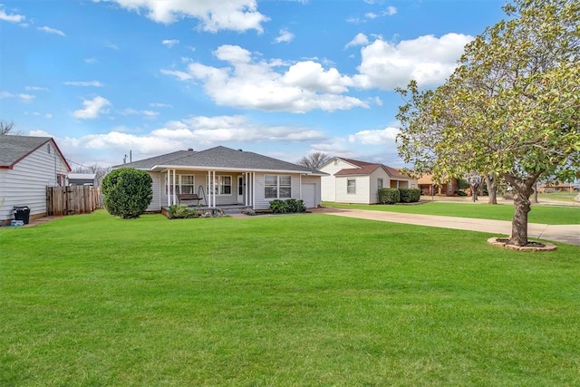 ranch-style home featuring a front lawn, covered porch, driveway, and fence