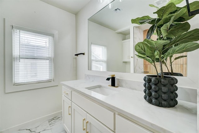 bathroom with visible vents, marble finish floor, vanity, and baseboards