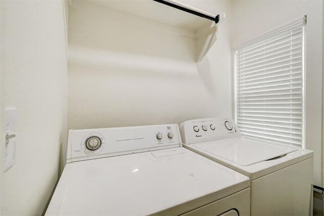 laundry room with washing machine and dryer